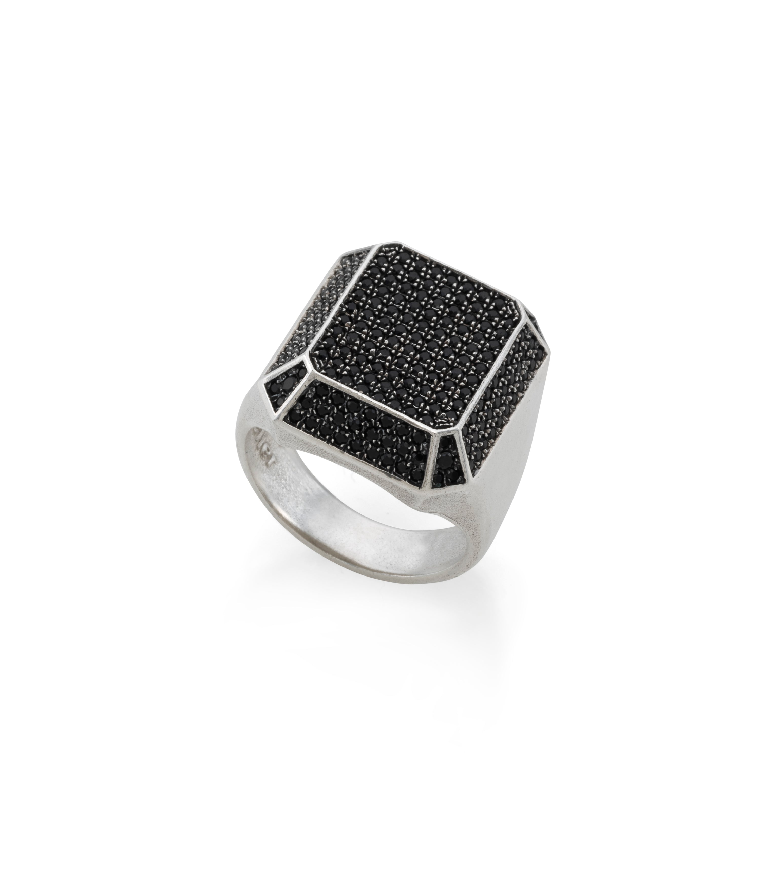 large silver signet ring with black stones