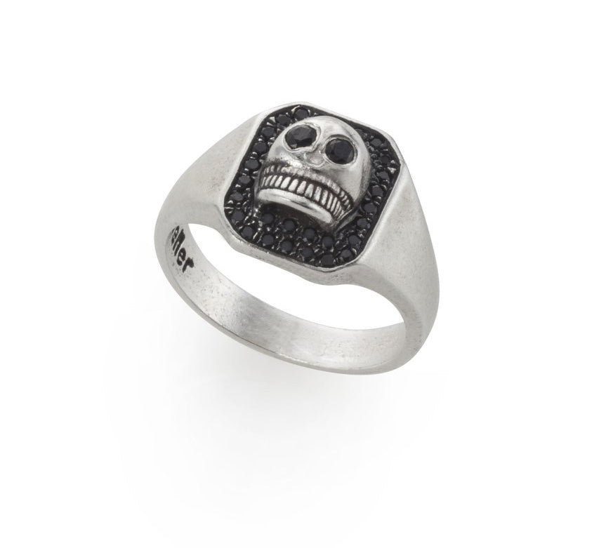 silver skull signet ring with black stones