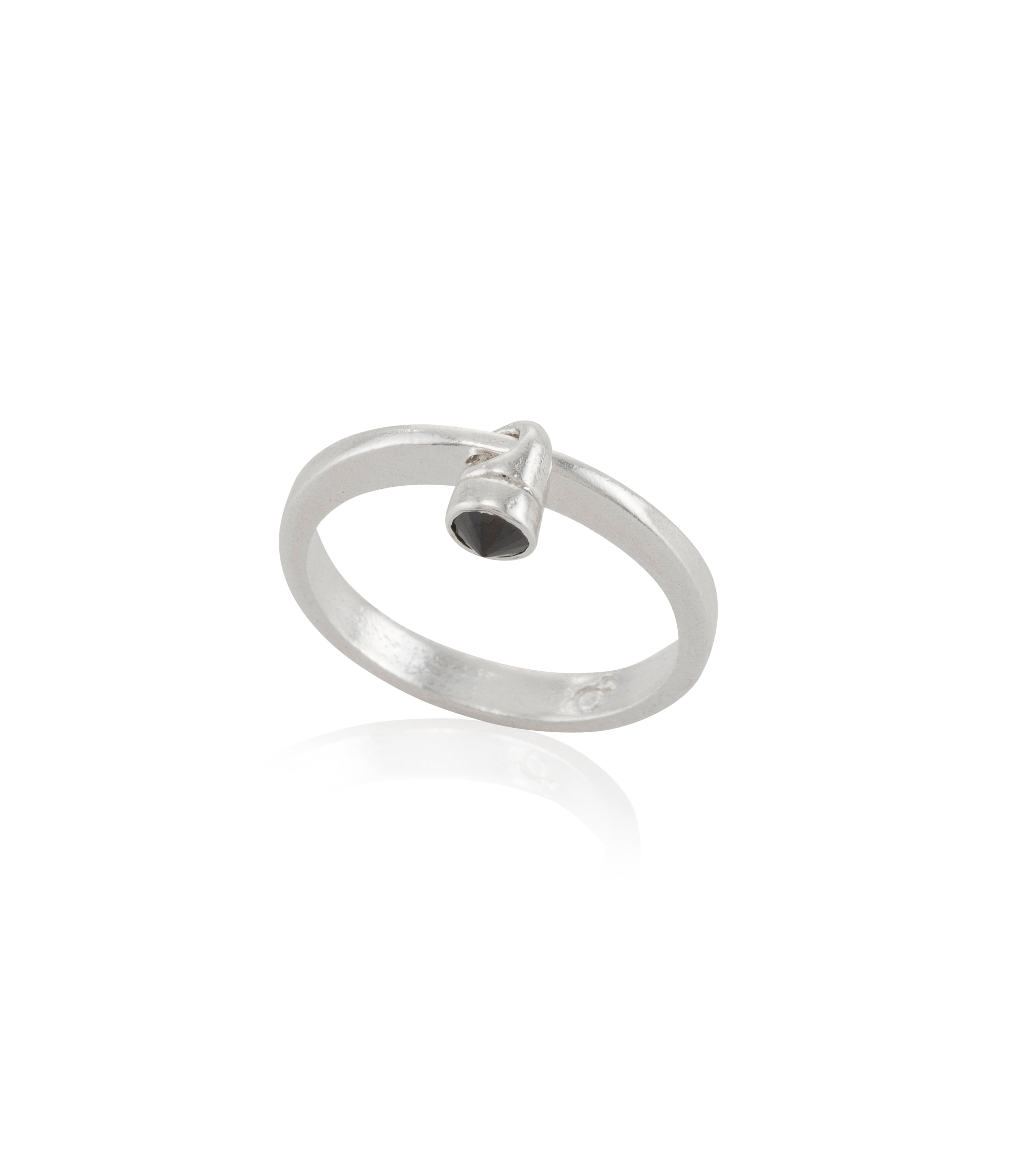 silver ring with a small black stone moving