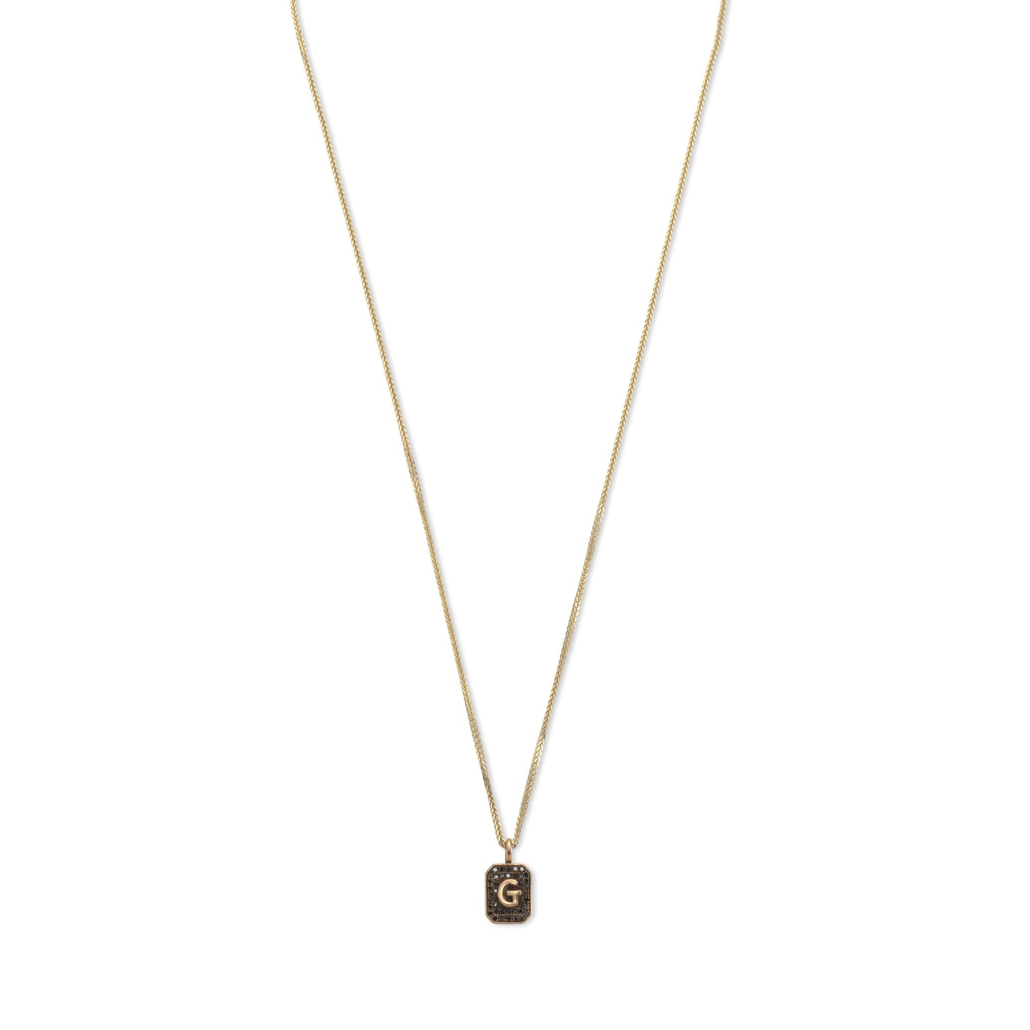 14k gold necklace with initials letter pendant with black diamonds, design by Maya Geller
