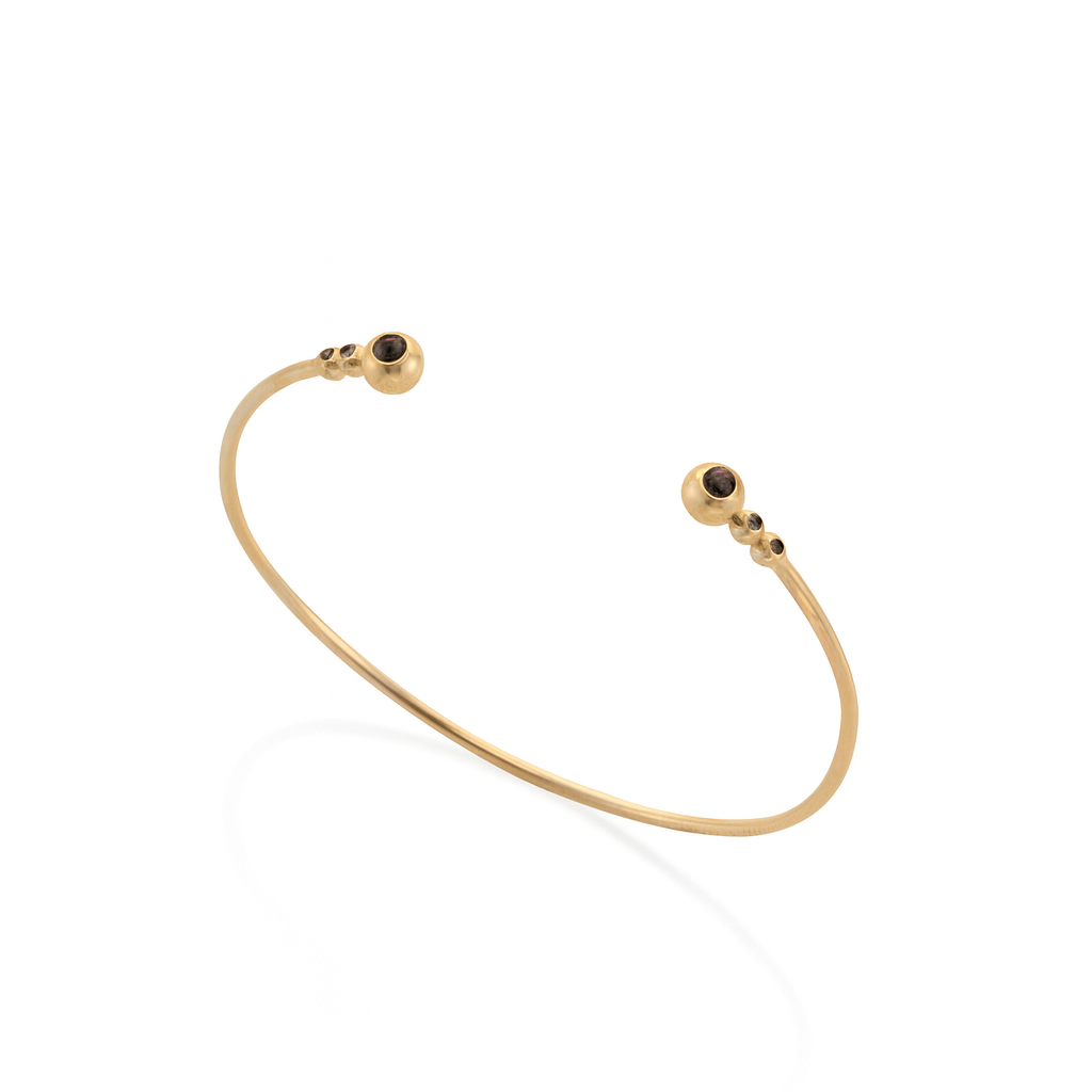 14k gold open bracelet with spheres of black diamonds
