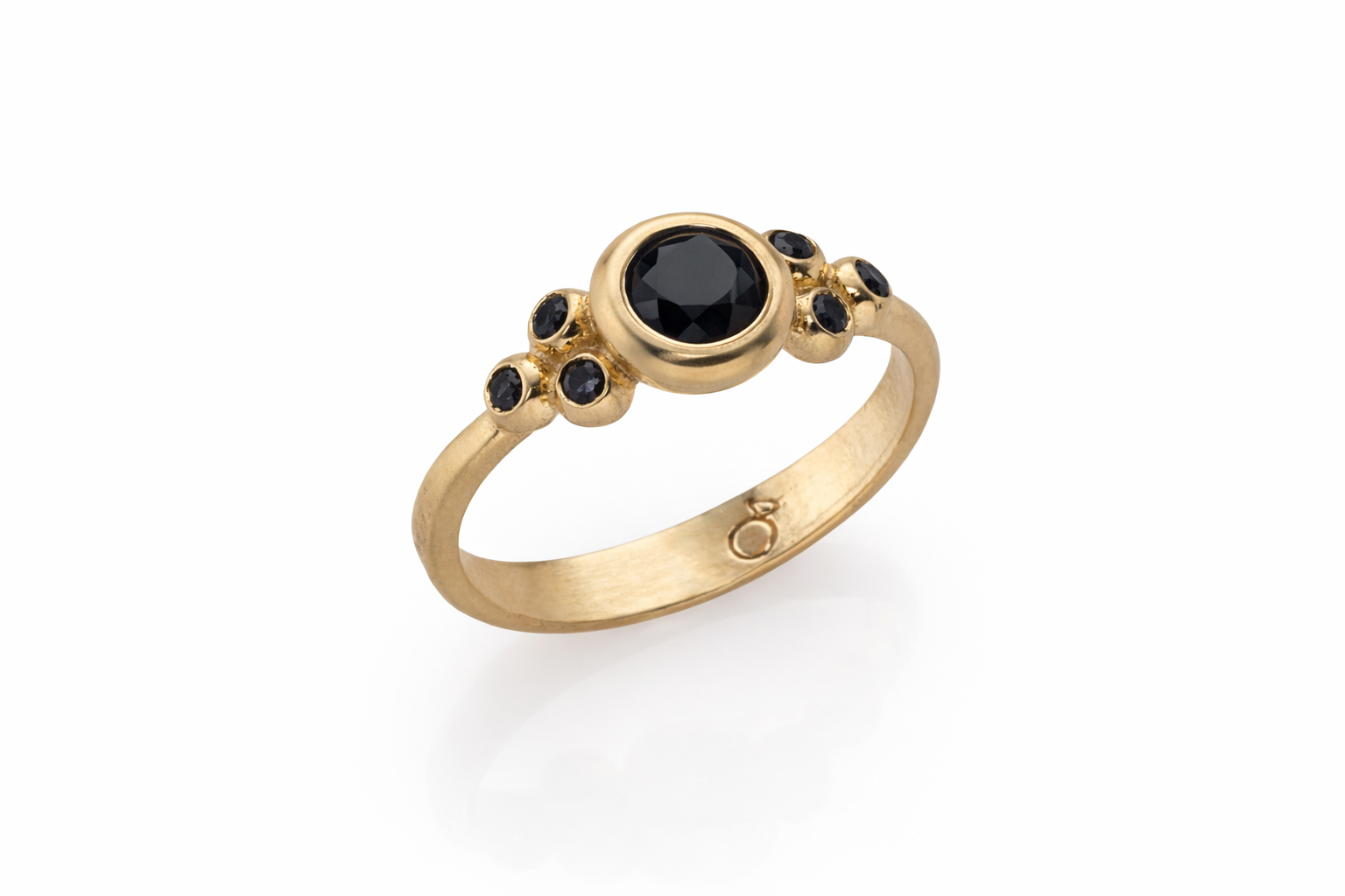 Gold ring with black diamonds