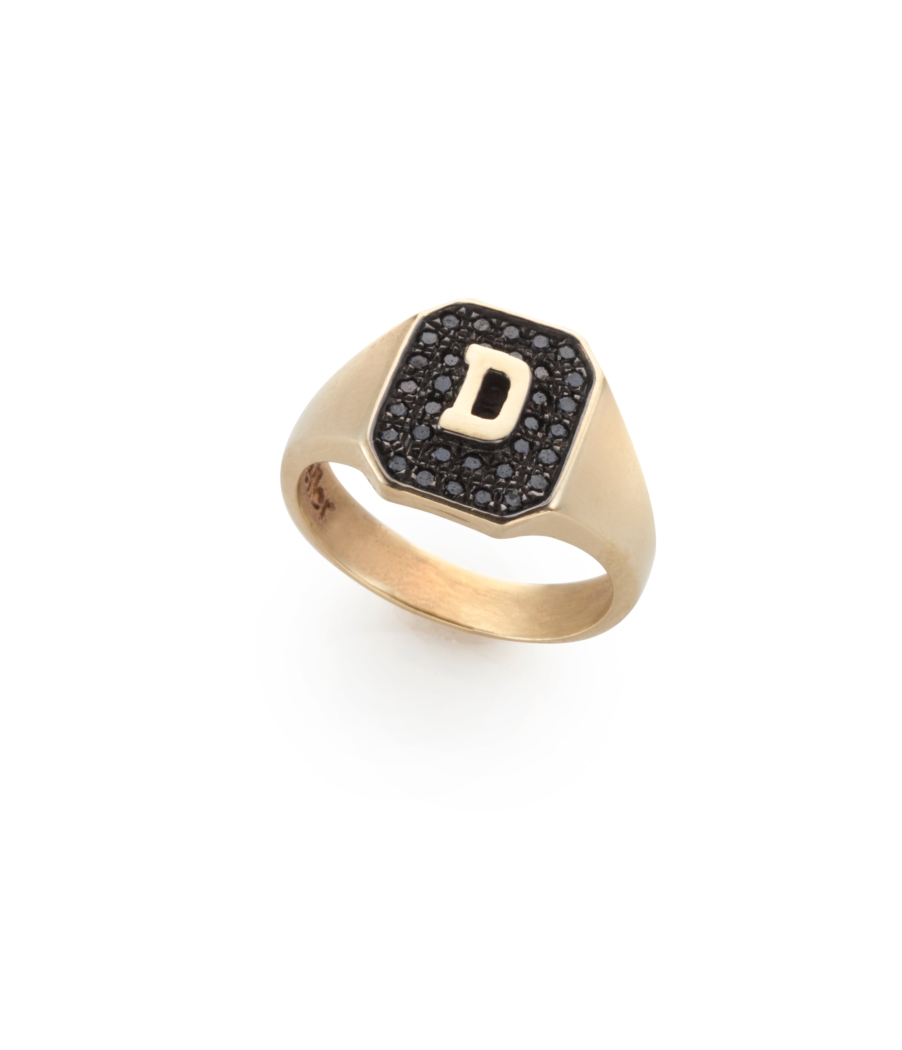 Gold ring with black gemstones and a letter 'D' on design by Maya Geller