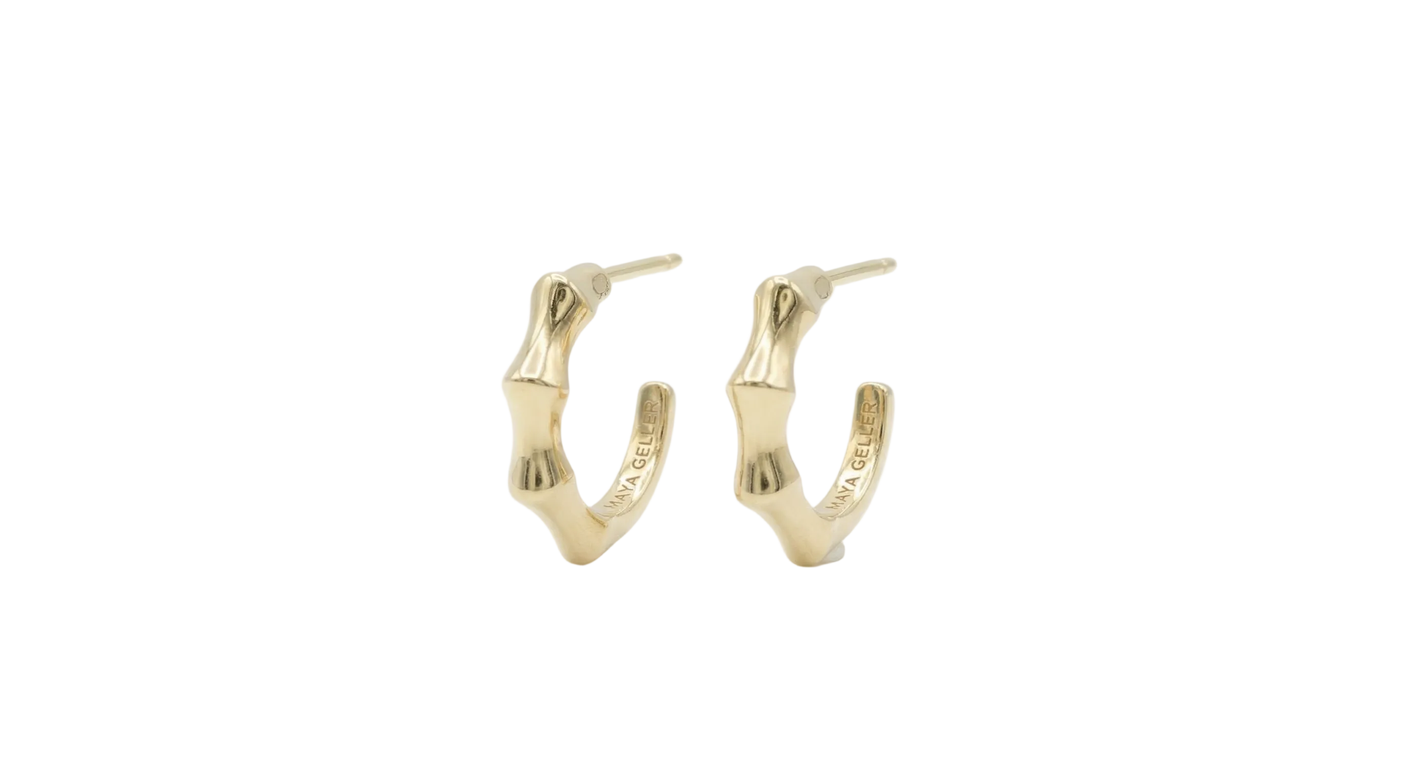 
gold hoops earrings by maya geller