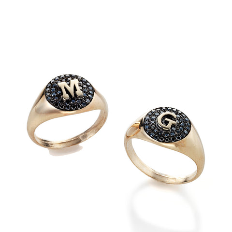14k gold ring with a letter and black diamonds