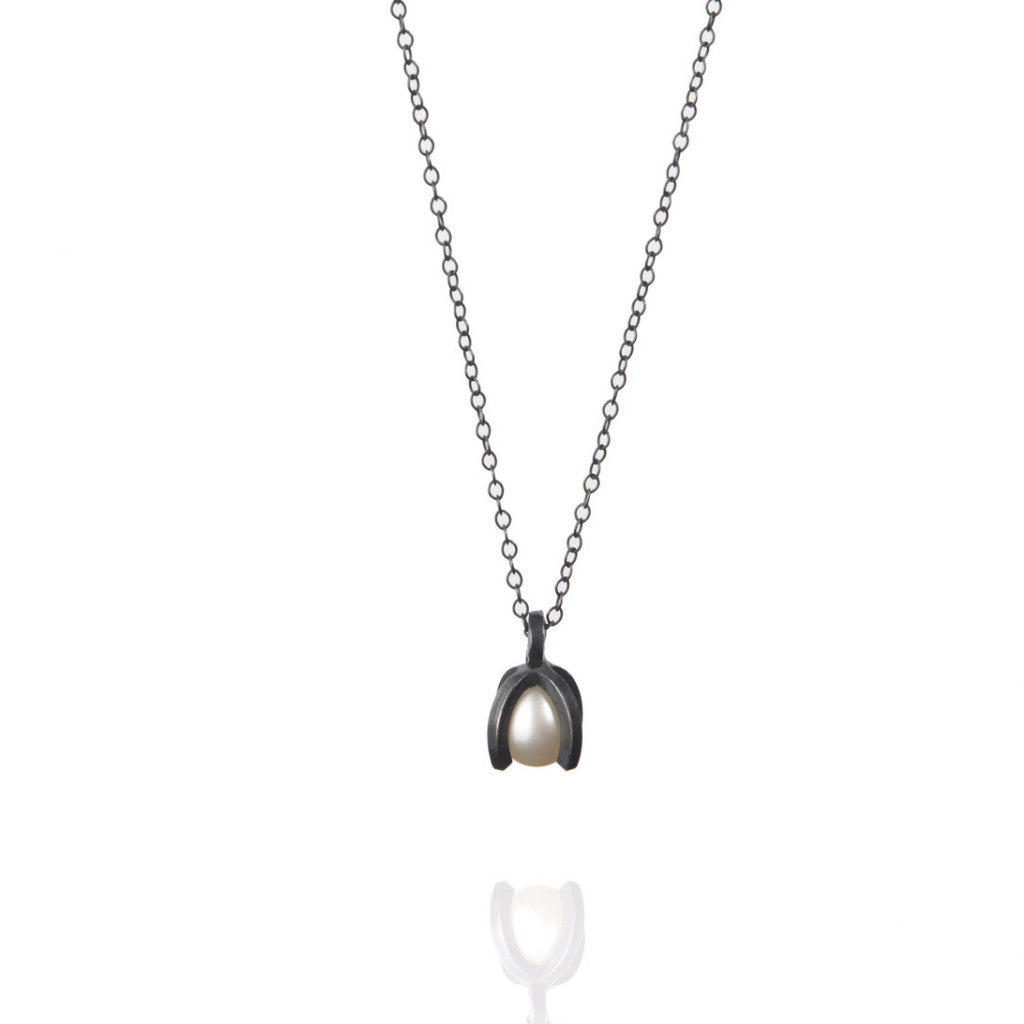 silver necklace with a pearl