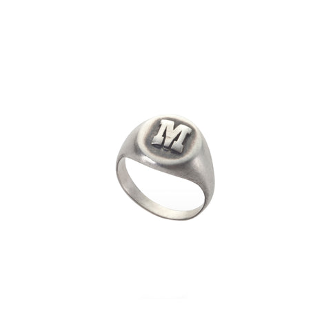 silver pinky ring with a letter