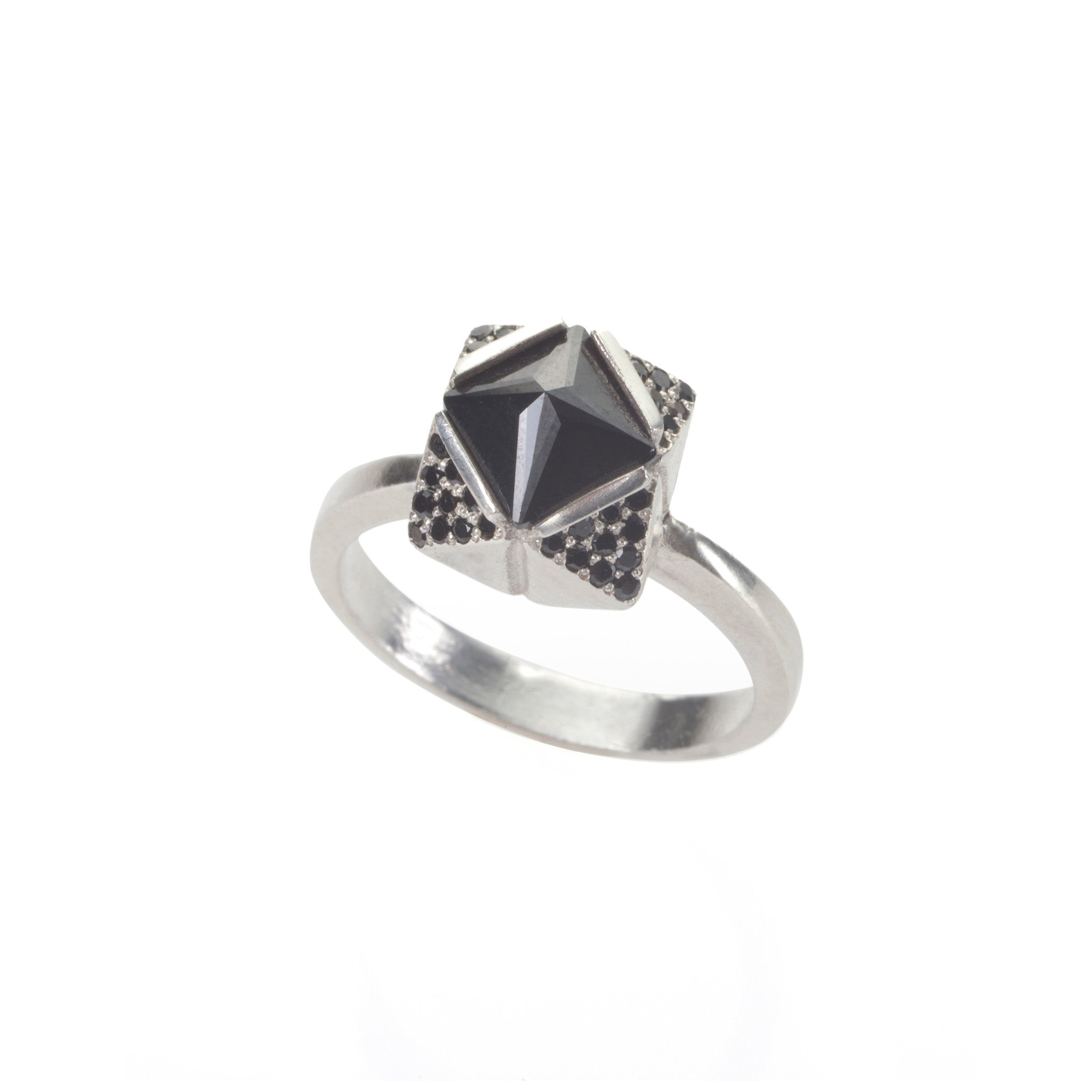 silver ring with black stones
