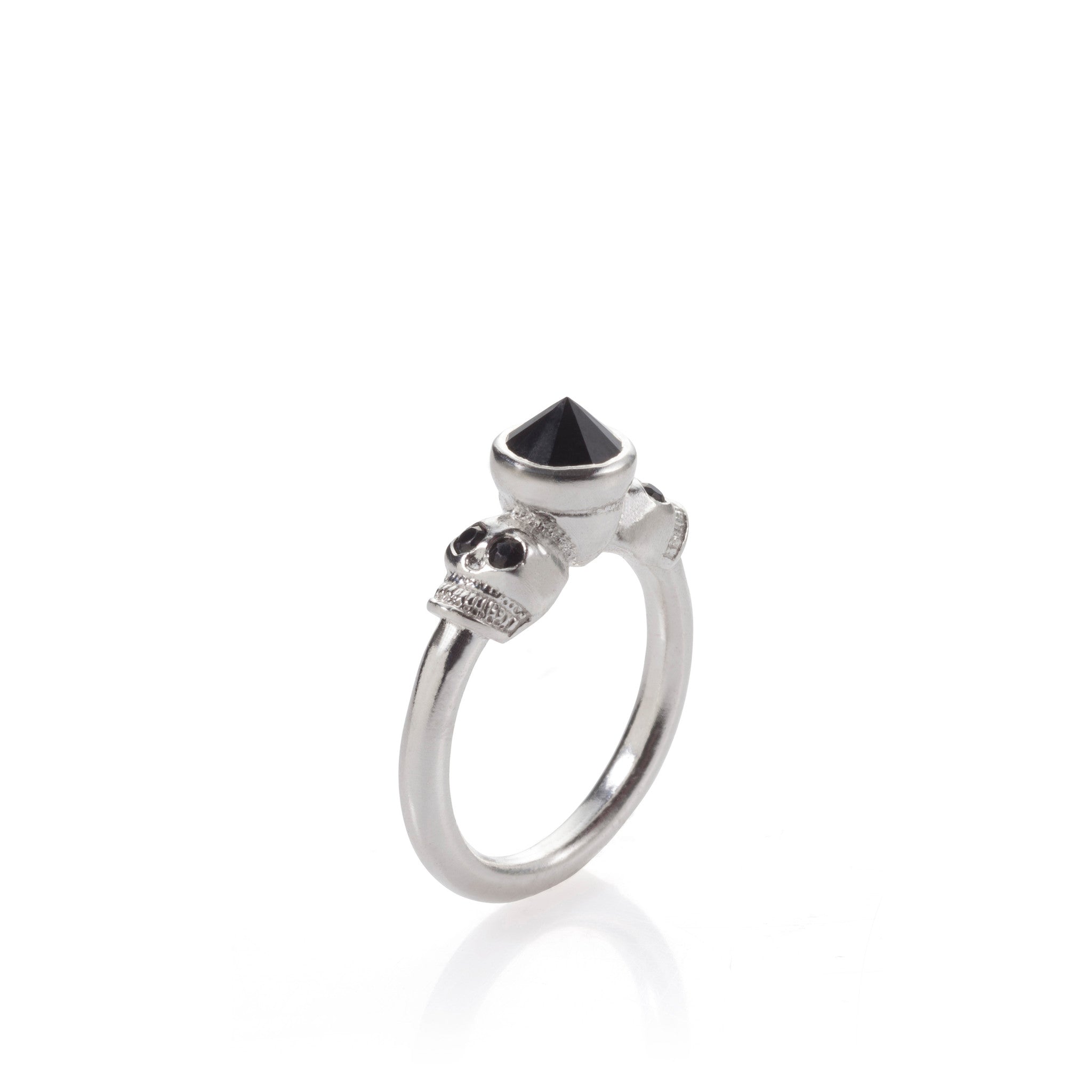 A silver ring with a black stone skull design on top.