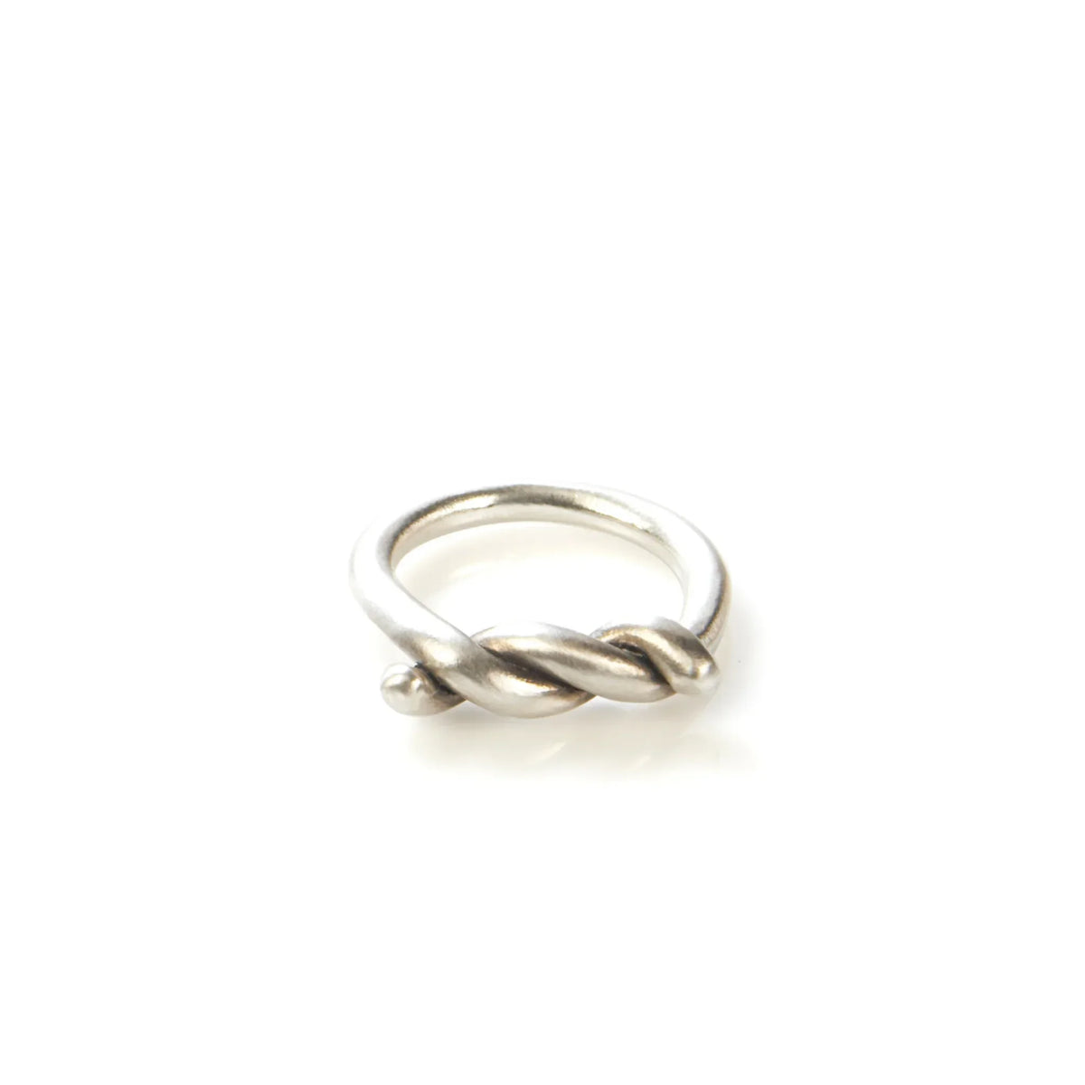 Sterling silver twisted knot ring on white background, minimalist unisex jewelry